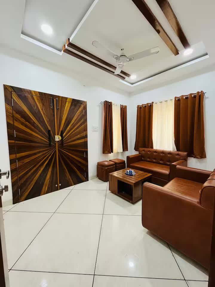 Living room with four sofas